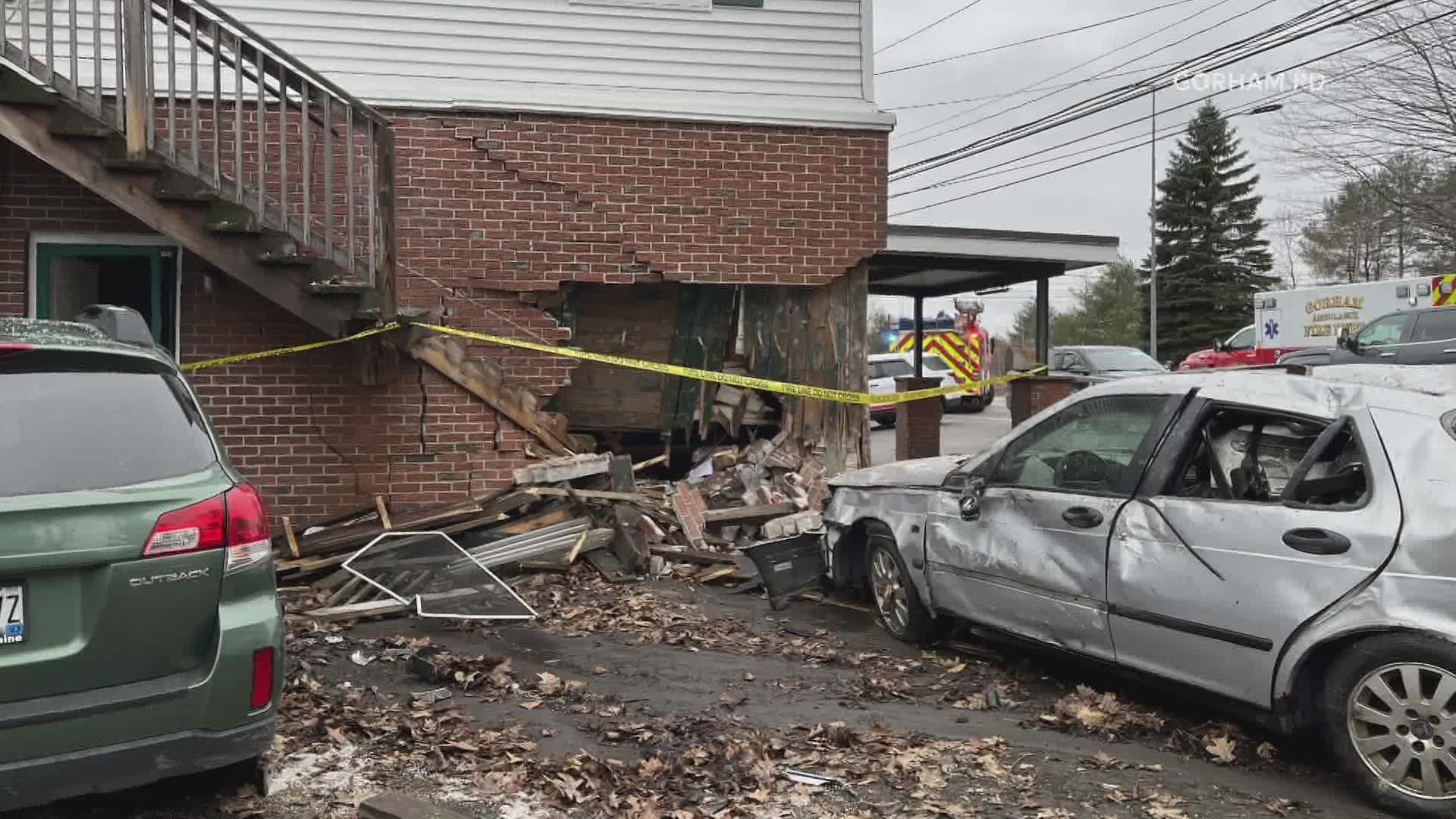 The driver and an apartment occupant reportedly suffered non-life-threatening injuries, a release said Wednesday.