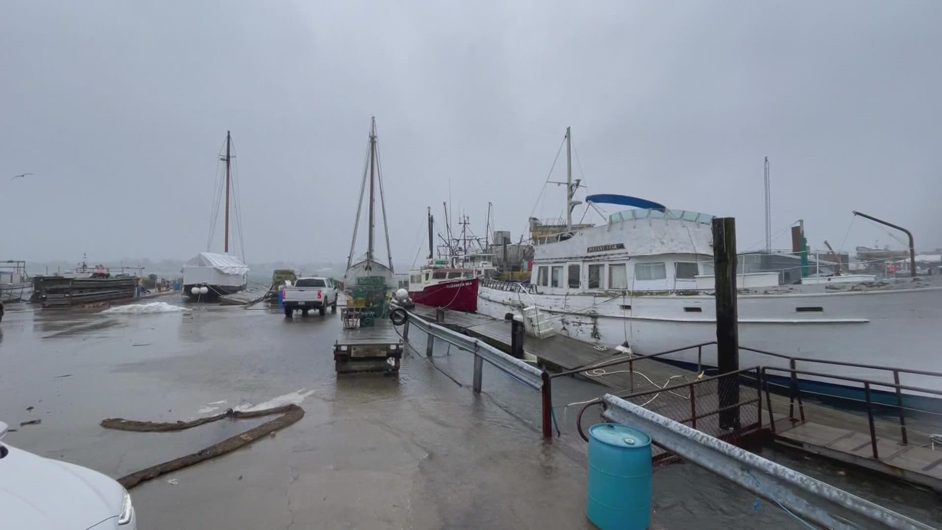 Portland Pier submerged as tide and waves spill onto the roadways