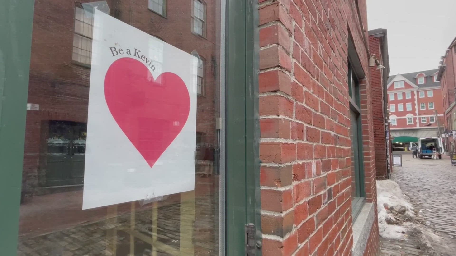 Hundreds of red hearts appeared on storefronts, mailboxes and even trash bins on Wednesday, with giant banners defying gusty winds.