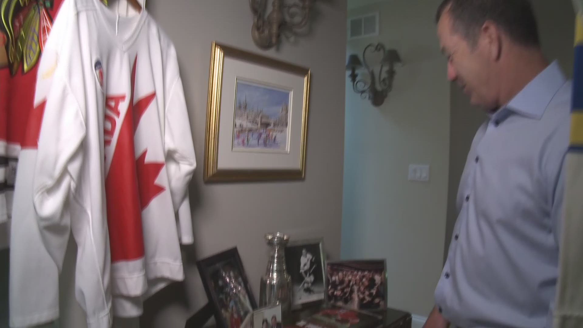 Former Hartford Whaler and Portland Pirates coach Kevin Dineen shows off some of his most treasured memorabilia, including the jersey of his "favorite and most respected" Boston Bruins player.