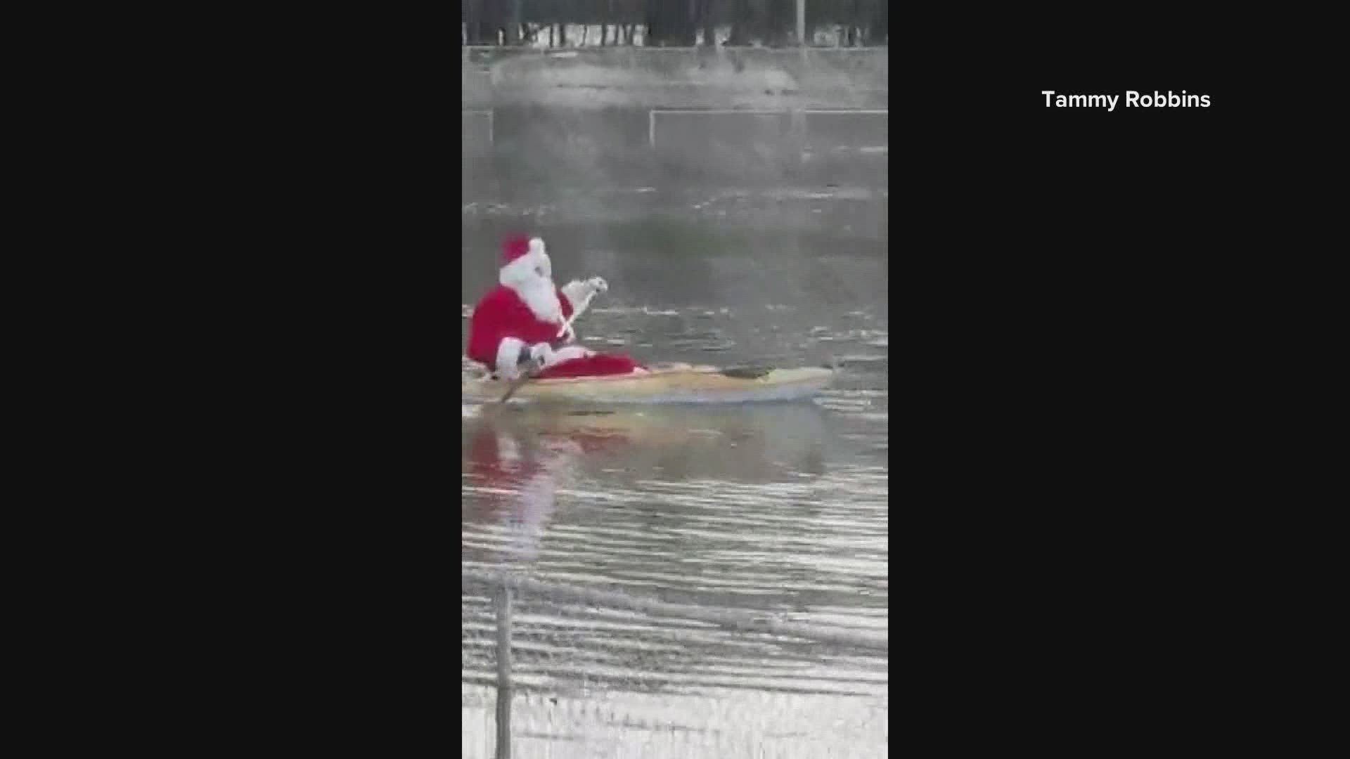 Gary Dollof of Rumford found his own way to cheer people up this ear, electing to go kayaking on a flooded baseball field, all while dressed as Santa Claus.