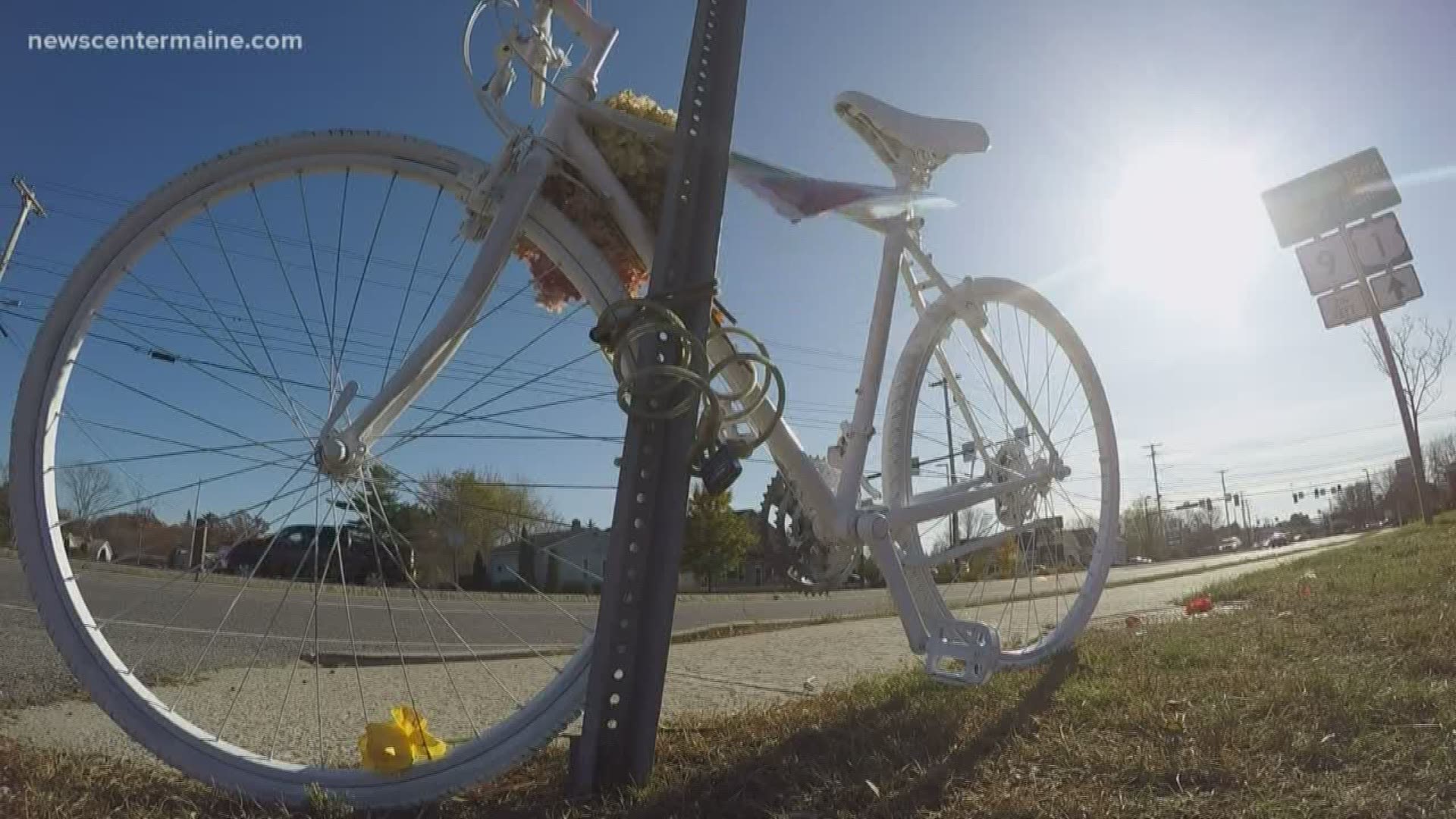 Family members try and honor the woman lost with a Ghost Bike roadside memorial