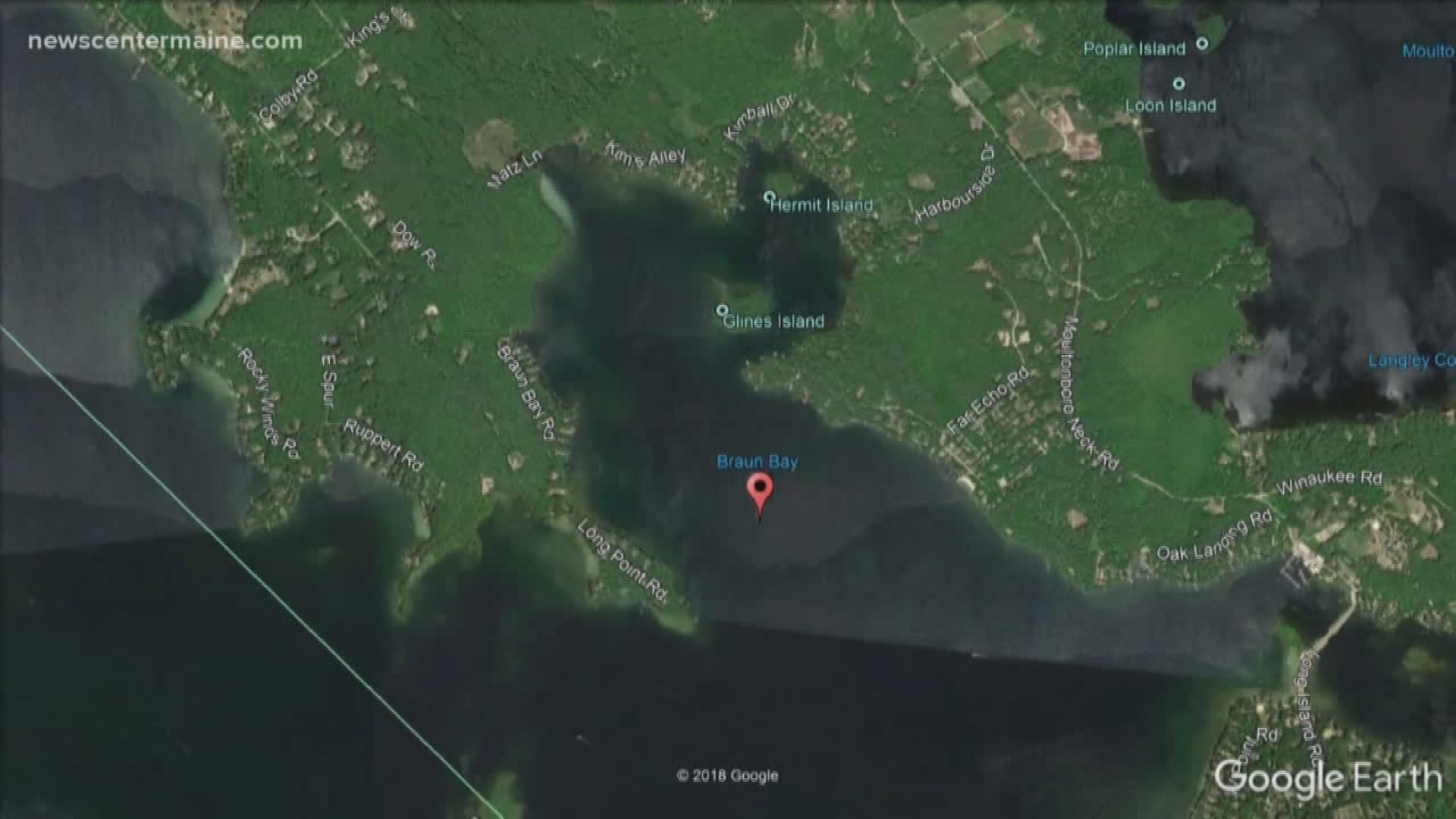 The body of a man was discovered floating by a paddleboarder in Lake Winnipesaukee on Sunday