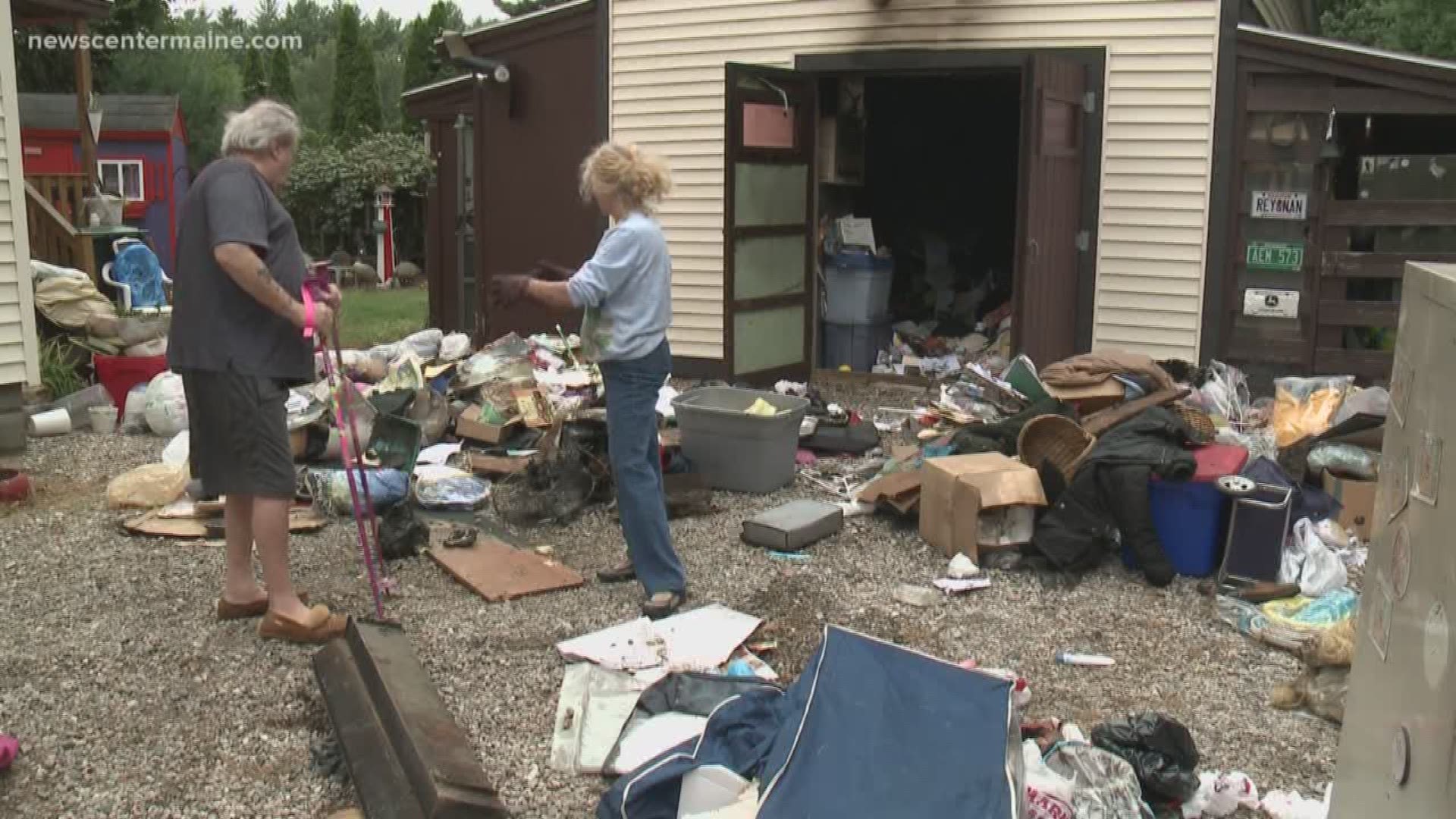 Saco couple cleaning up after fire