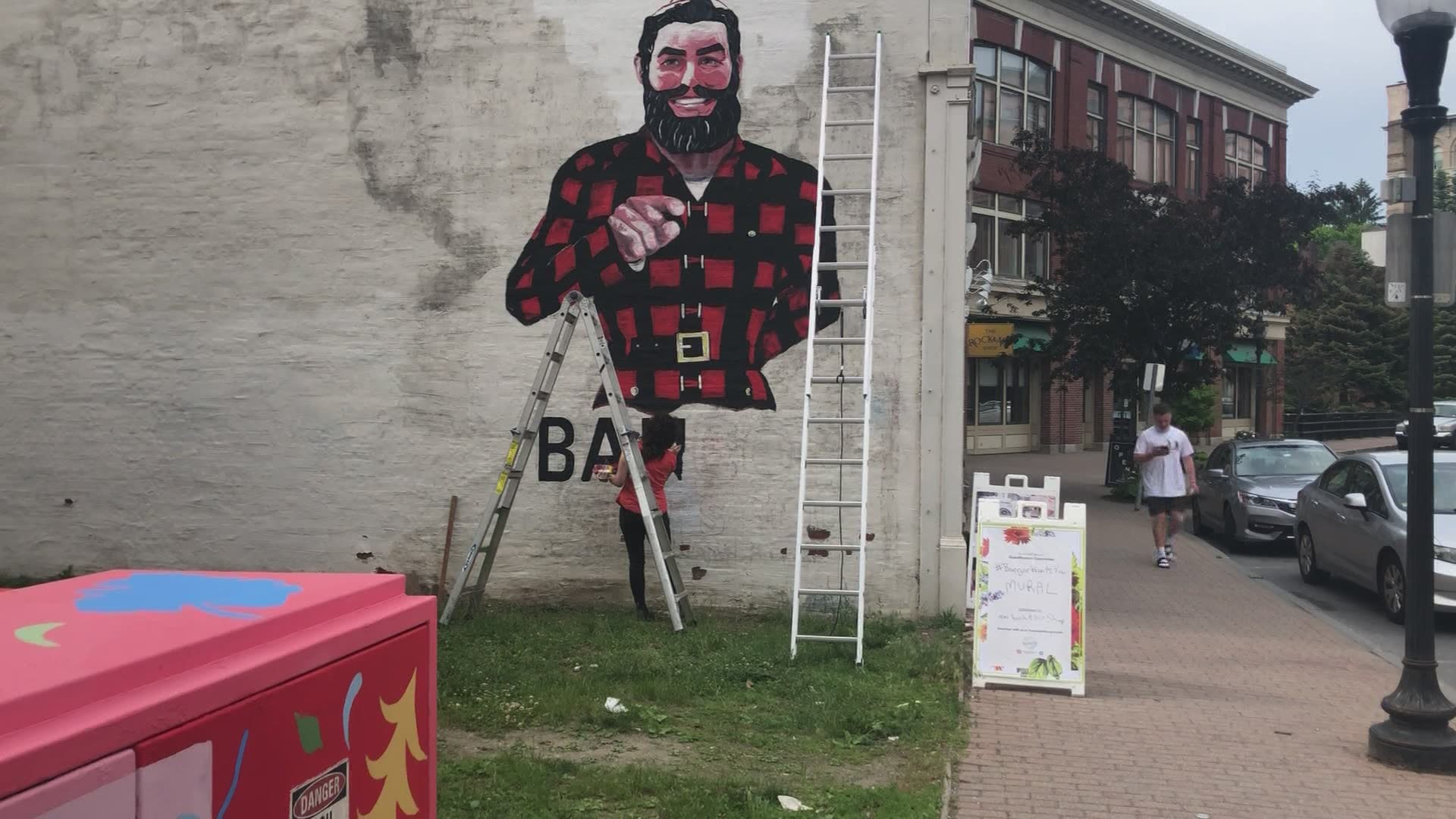 In an open lot on Central Street downtown, a portrait of the giant lumberjack and folk hero has been going up for almost a week.  Scheduled to be finished tomorrow.