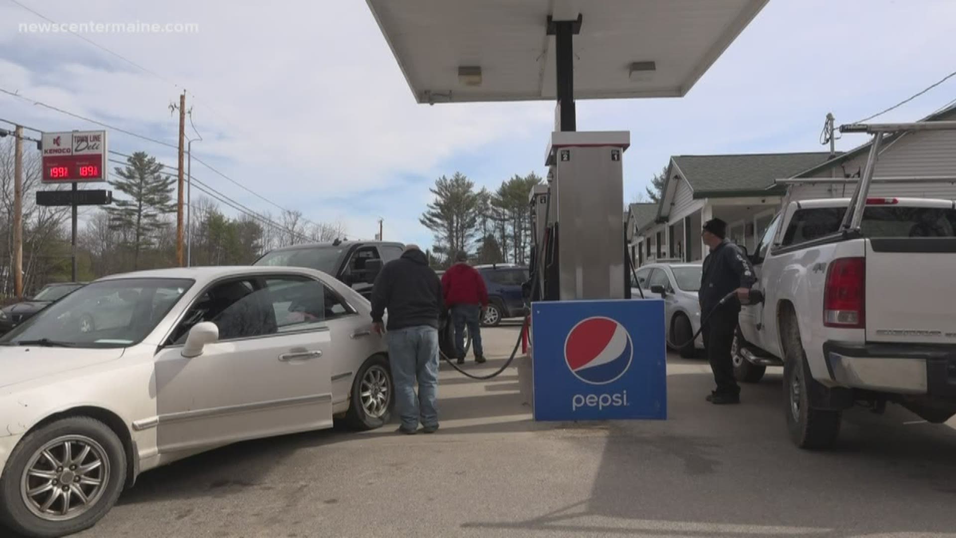 Cars lined up at the Town Line Deli in Waterboro Wednesday to fill up at $1.99 per gallon for regular gasoline.
