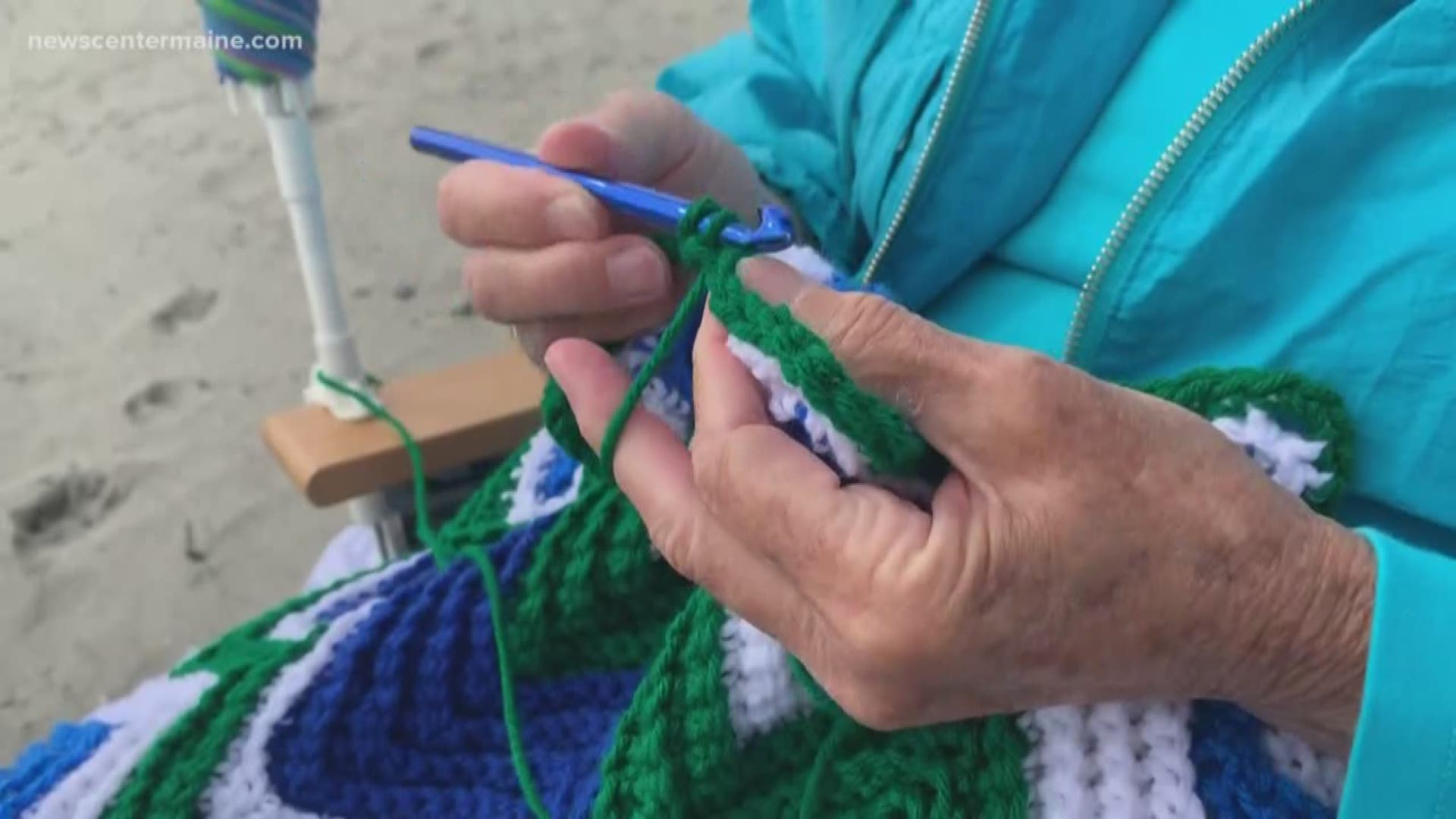 Lois Griswold crochets afghans on York beach all while looking for new friends.