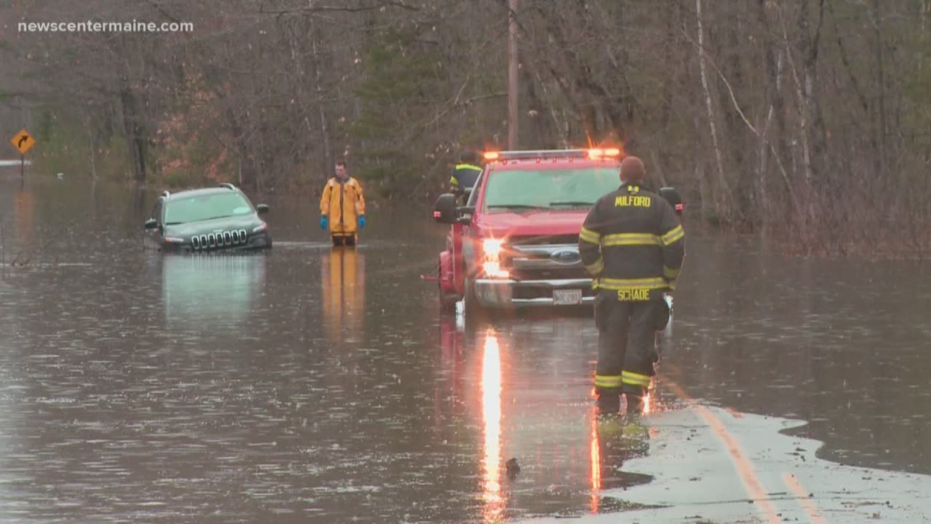 An SUV got stuck in the water after flooding in Milford on Wednesday.