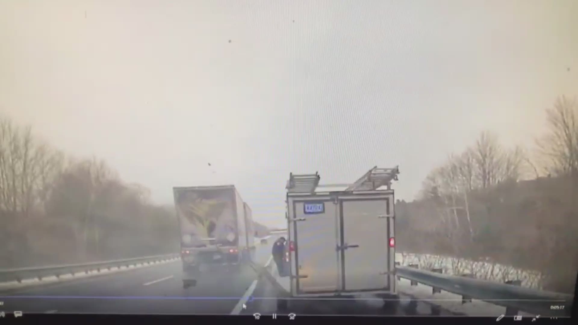 Lt. Brian Quinn of the Sagadahoc County Sheriff's Department is almost hit by 18 wheeler while on a traffic stop on I-295