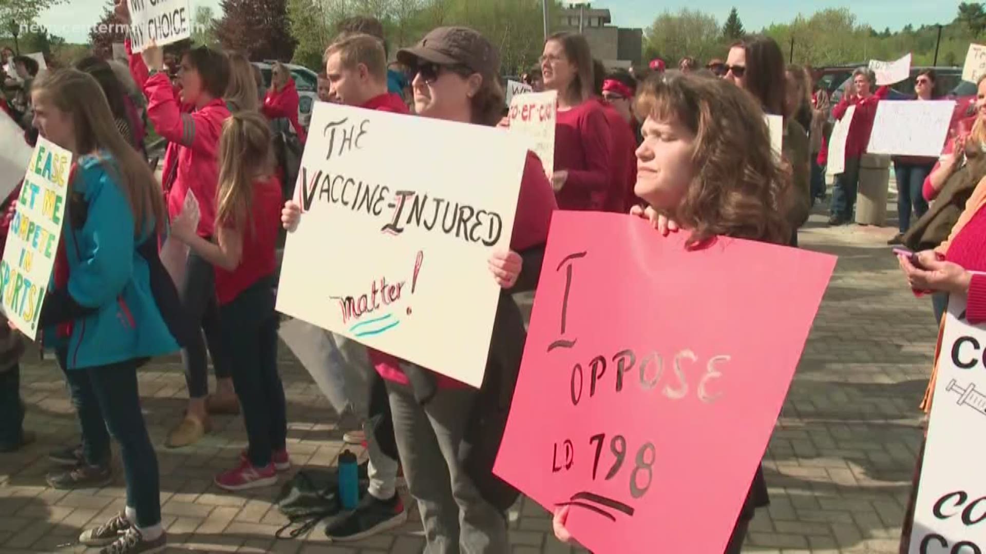 Protesters gathered in Augusta Thursday to rally against the mandatory vaccination bill now headed for a final vote in the Senate.