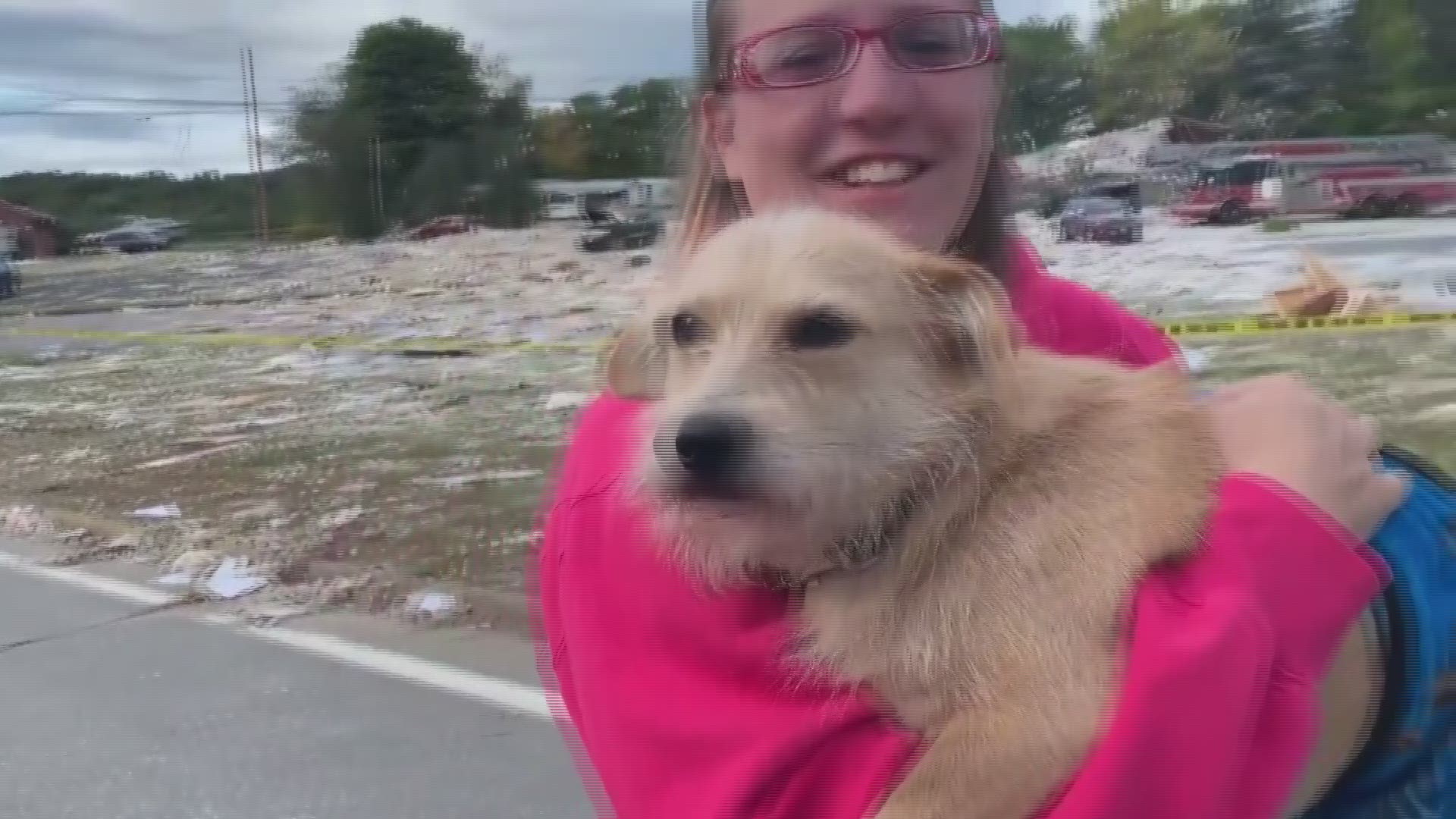 Jaime Green who lived behind LEAP Inc., finds one of her lost pets after Farmington explosion