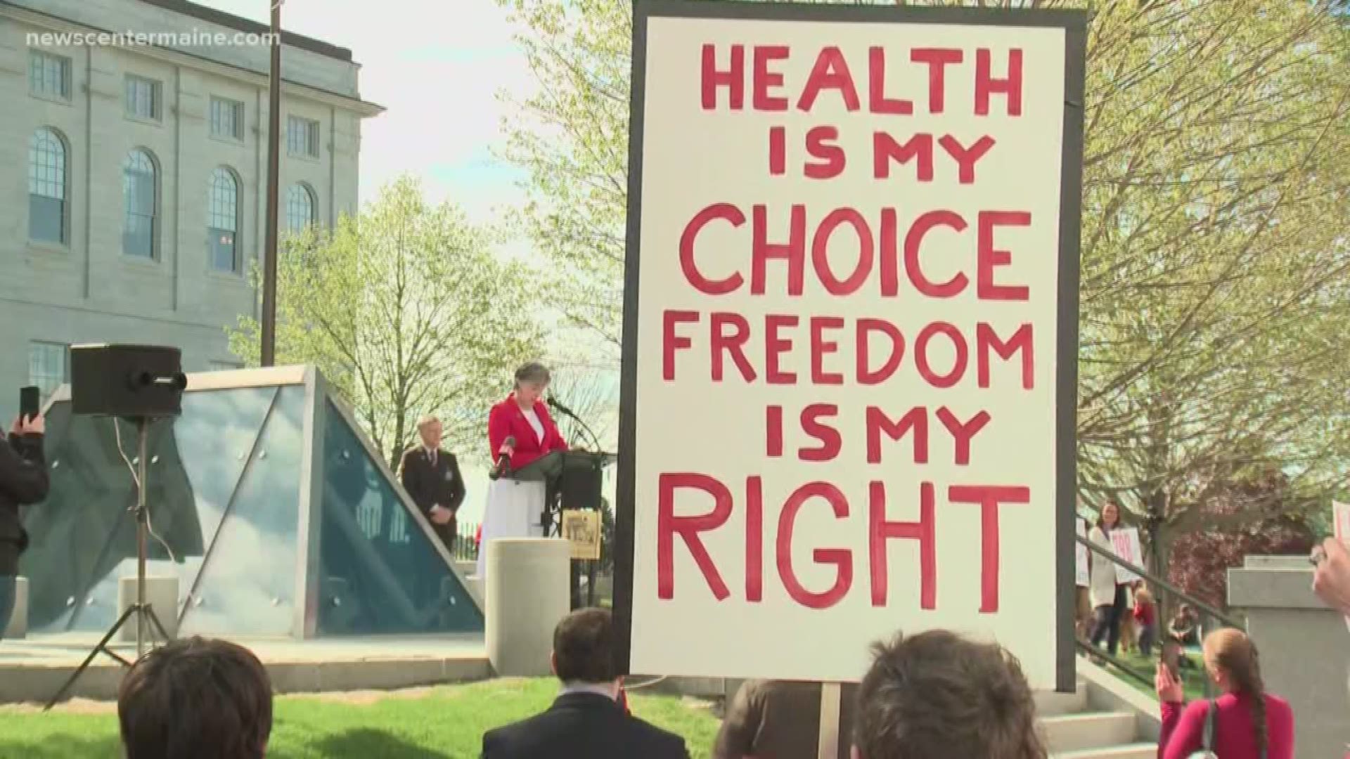Mainers opposed to a bill that would remove religious and philosophical exemptions from vaccines rallied at the State House Thursday.