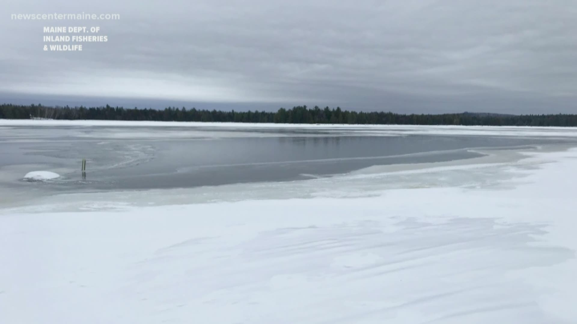 The Maine Department of Inland Fisheries and Wildlife says a father and daughter barely survived after falling throught the ice while snowmobiling.