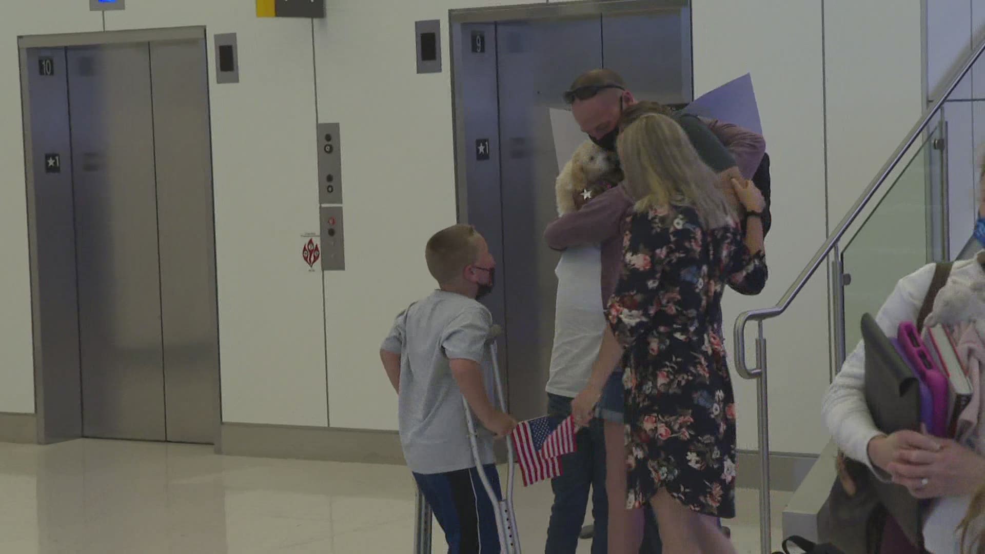Family and friends gathered at the Portland Jetport to surprise Air Force Lieutenant Colonel Gregory Ward after a 13-month deployment in Kuwait