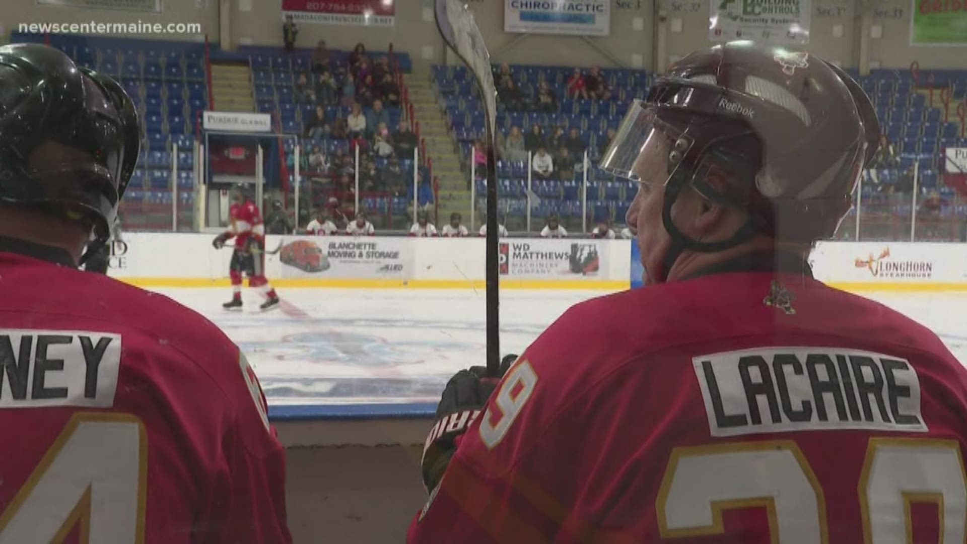 Firefighters from Maine and Worcester Massachusetts put on a different kind of uniform to face off on the ice in Lewiston.