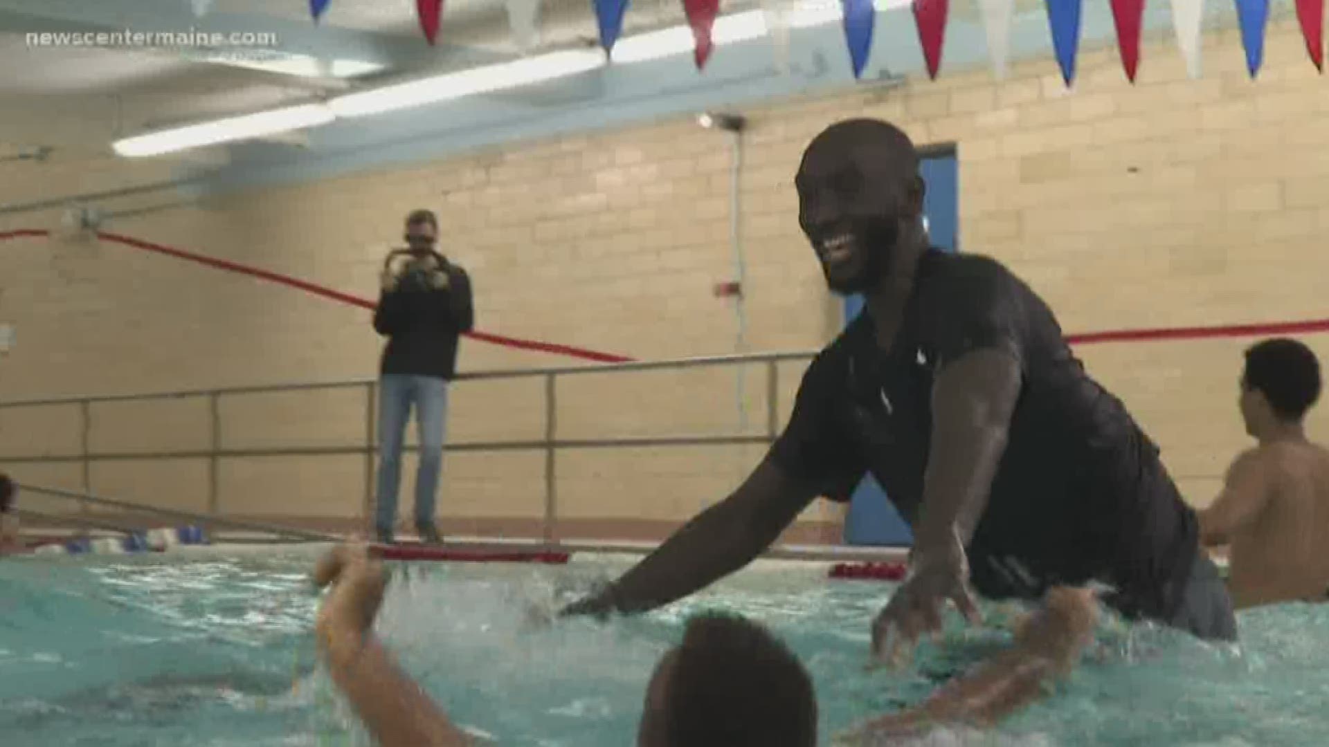 Despite their huge difference in height, Red Claws center Tacko Fall is on the same skill level as the kids at a swimming lesson in Portland on Friday, Nov. 22, 2019