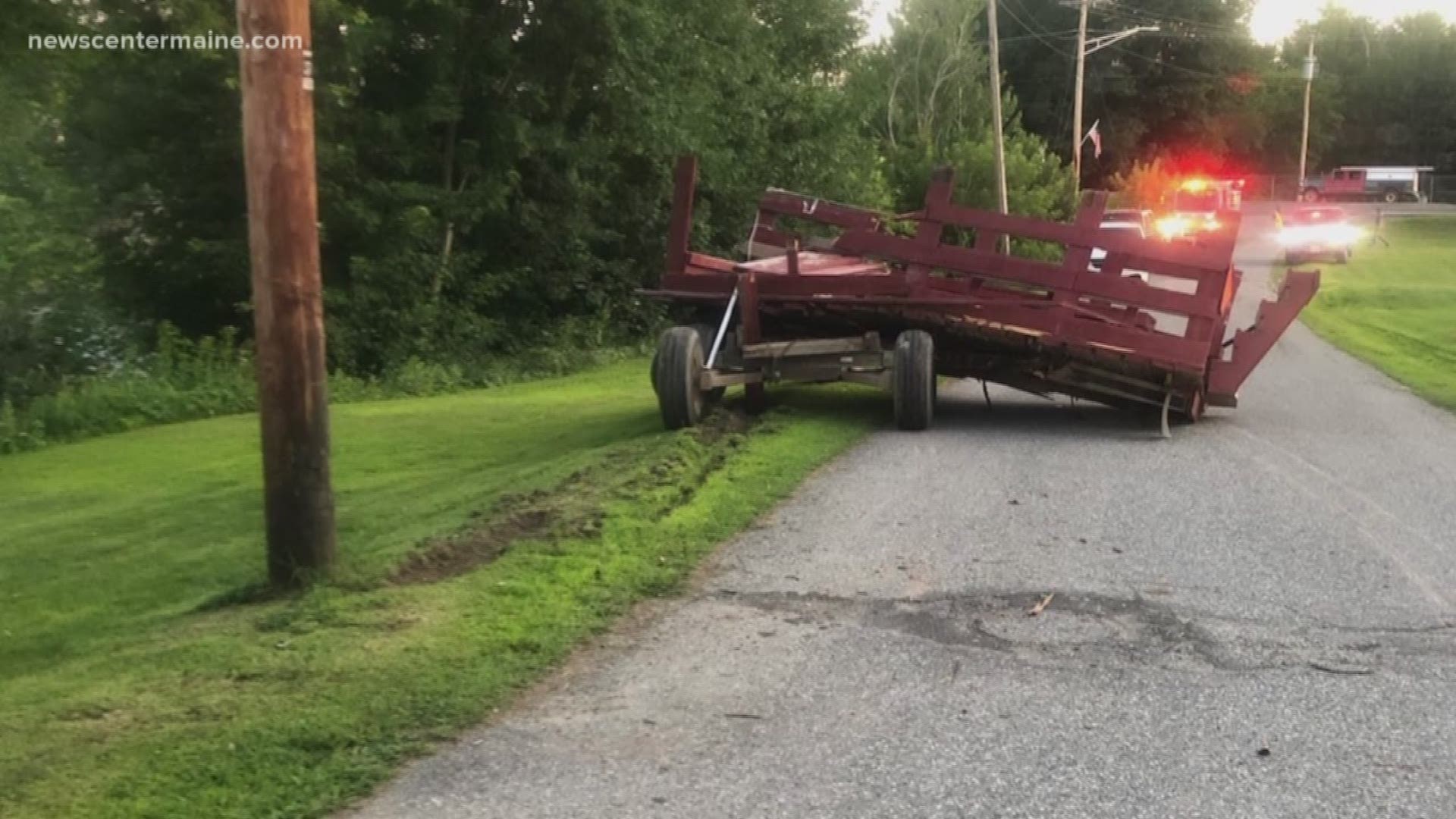 Maine police say four people were hurt Sunday when a horse-drawn wagon hit a vehicle and a telephone pole.