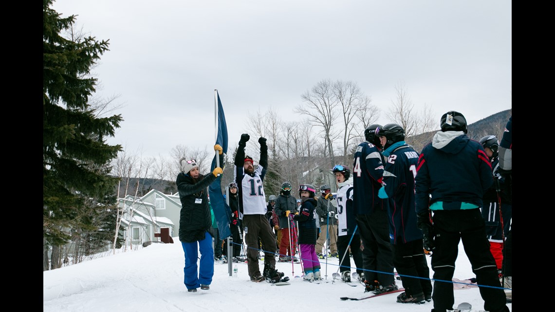 Fans of the New England Patriots NFL football team ski en masse at the  Sugarloaf ski resort, Sunday, Feb. 3, 2019, in Carrabassett Valley, Maine.  About 200 skiers took part to show