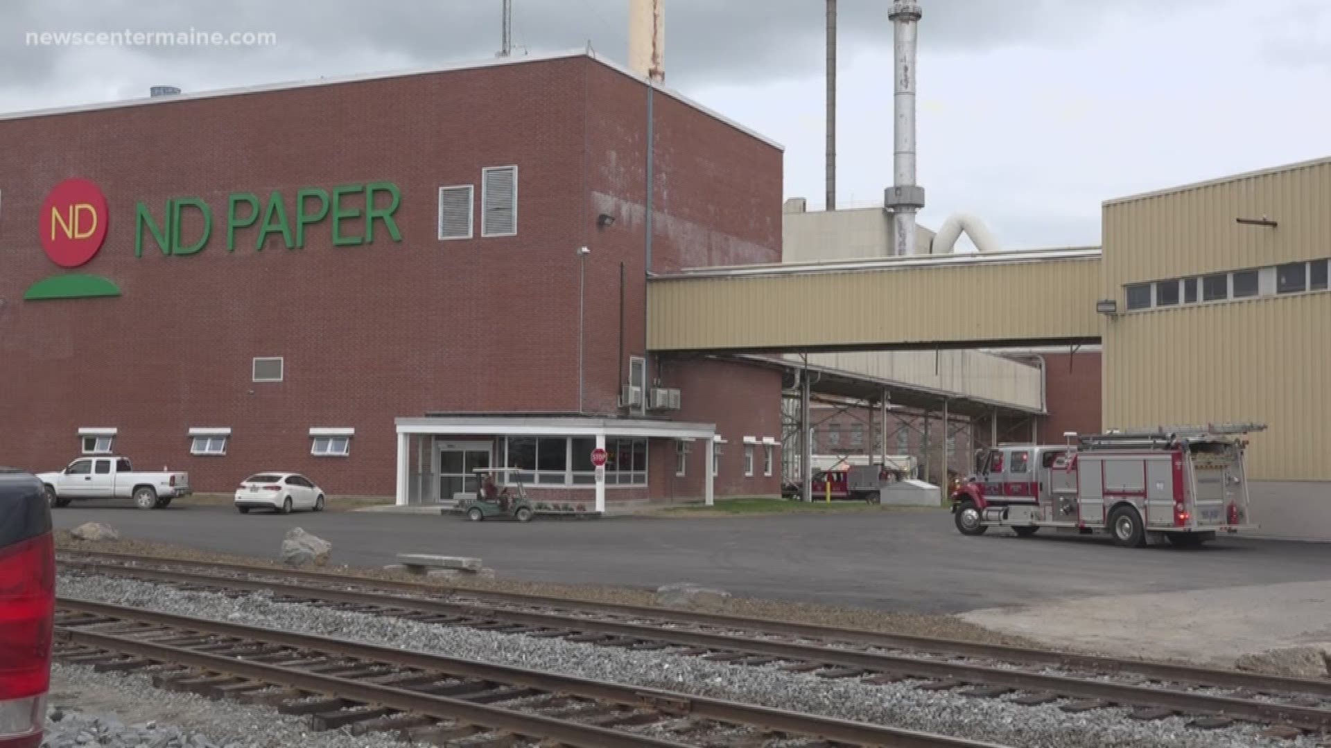 Two firefighters were injured this morning as they helped extinguish a fire at the newly reopened Old Town Pulp Mill.