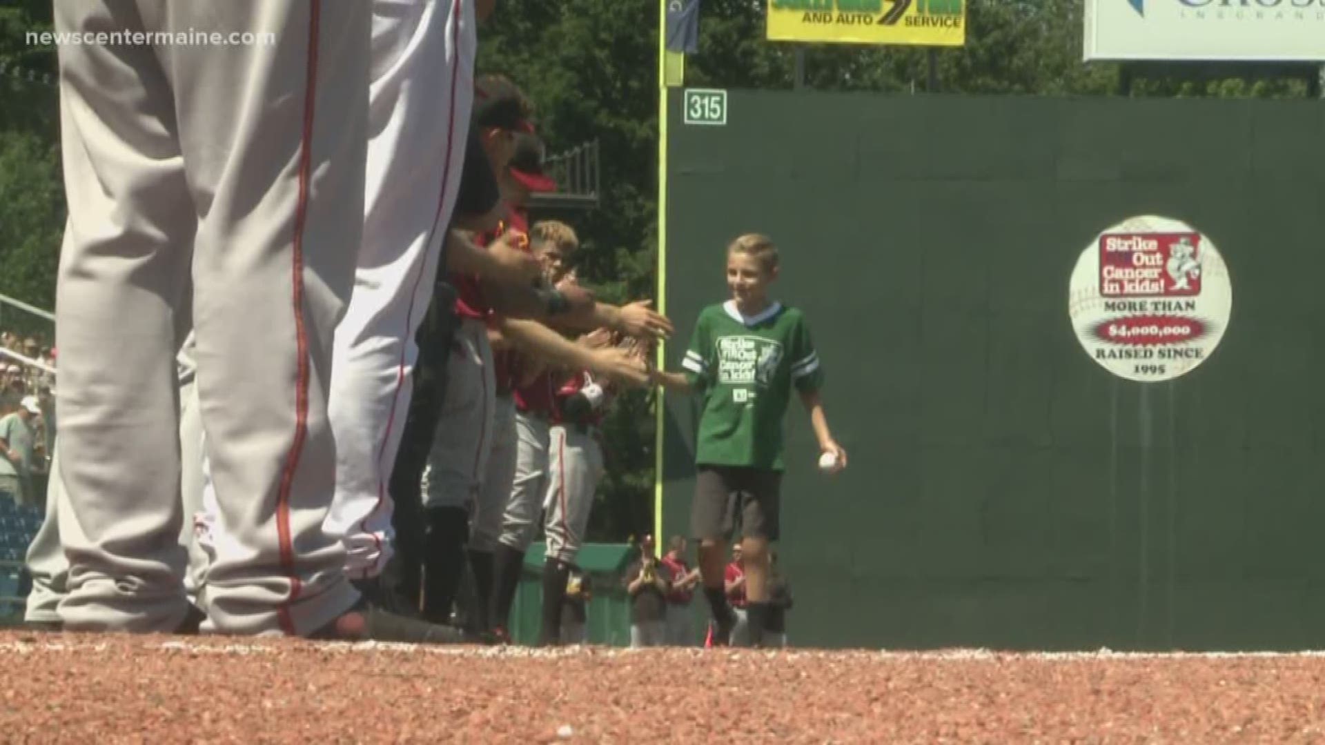 Boy walks the bases of Hadlock after overcoming cancer