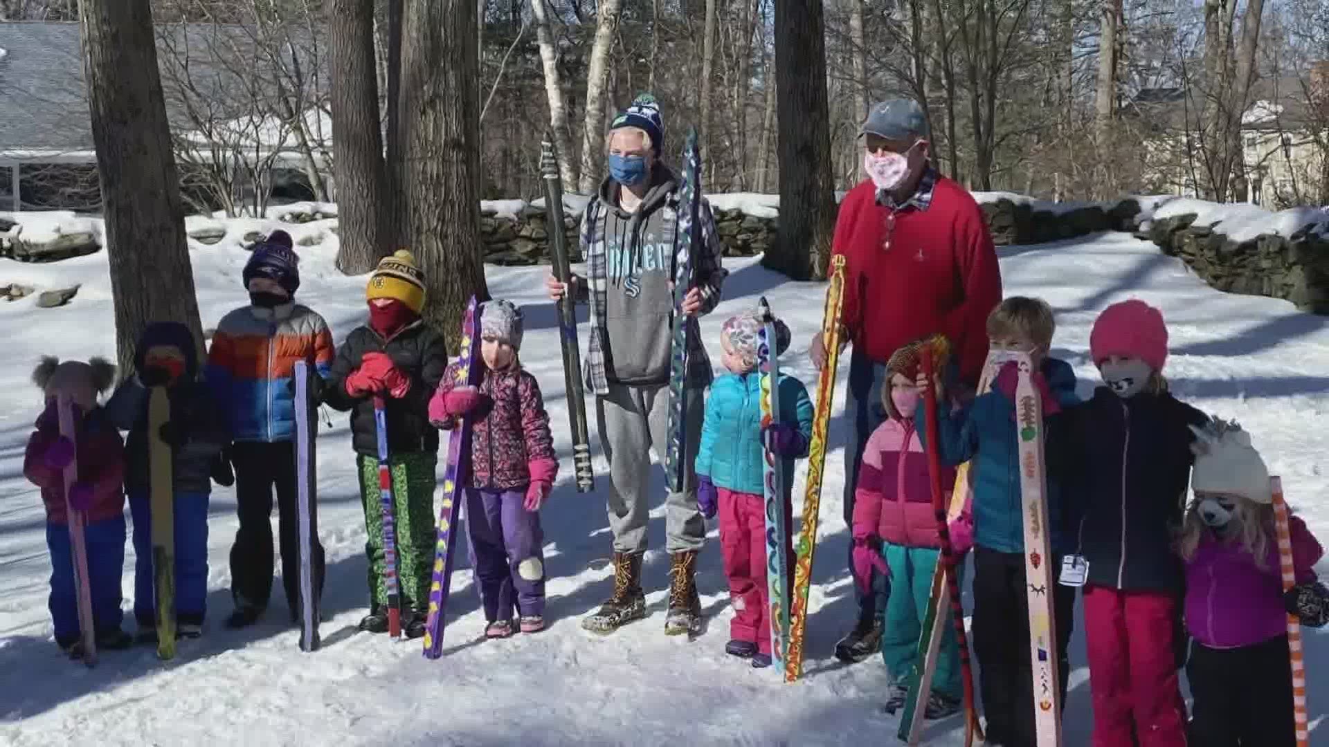 A group in Cape Elizabeth gathers on their street corner for cocktails and snow races.
