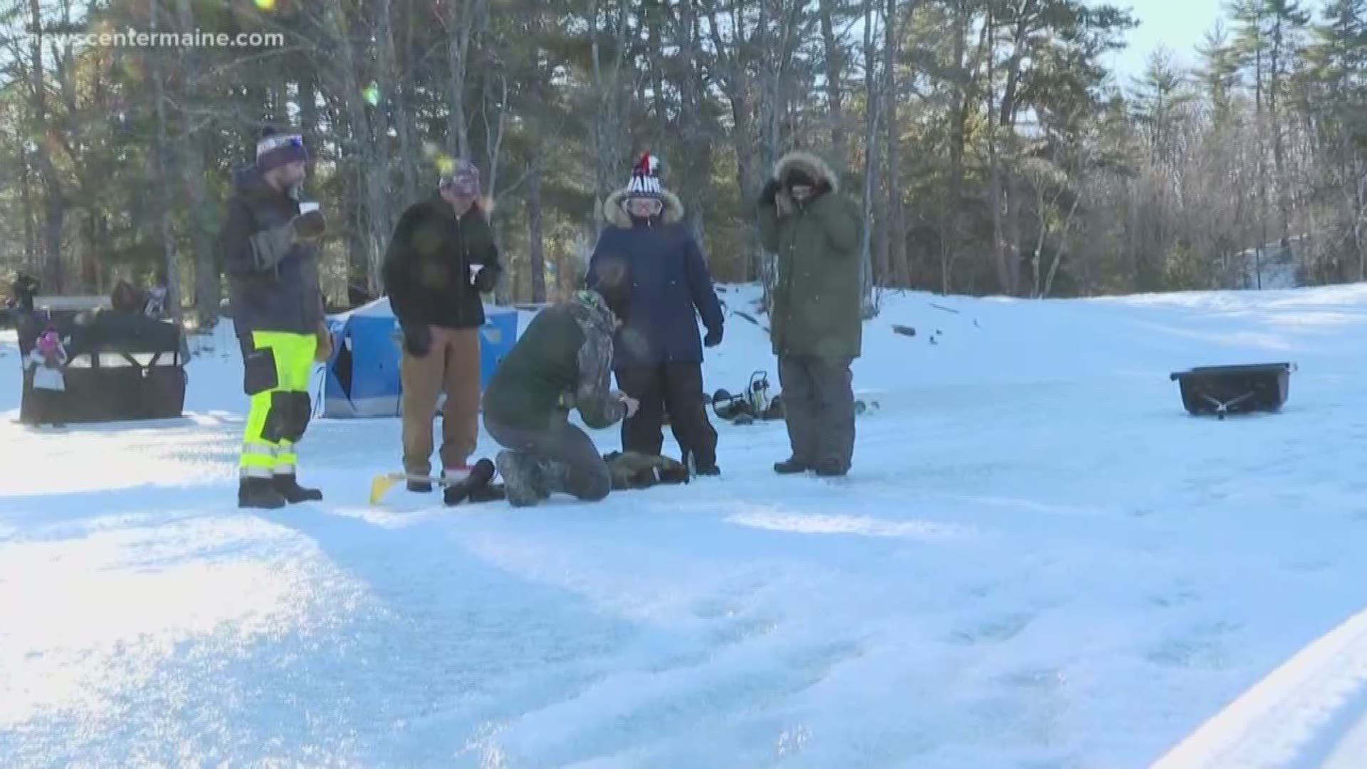 Despite frigid temperatures, some Maine game wardens invited veterans for a day of ice fishing.