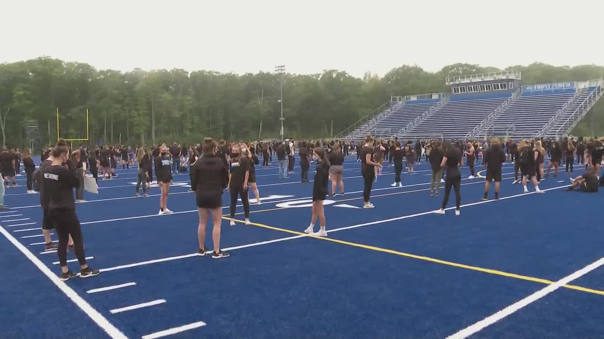 UNE football players organize BLM march across campus