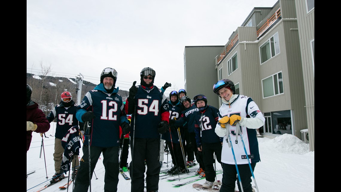 Fans of the New England Patriots NFL football team ski en masse at the  Sugarloaf ski resort, Sunday, Feb. 3, 2019, in Carrabassett Valley, Maine.  About 200 skiers took part to show