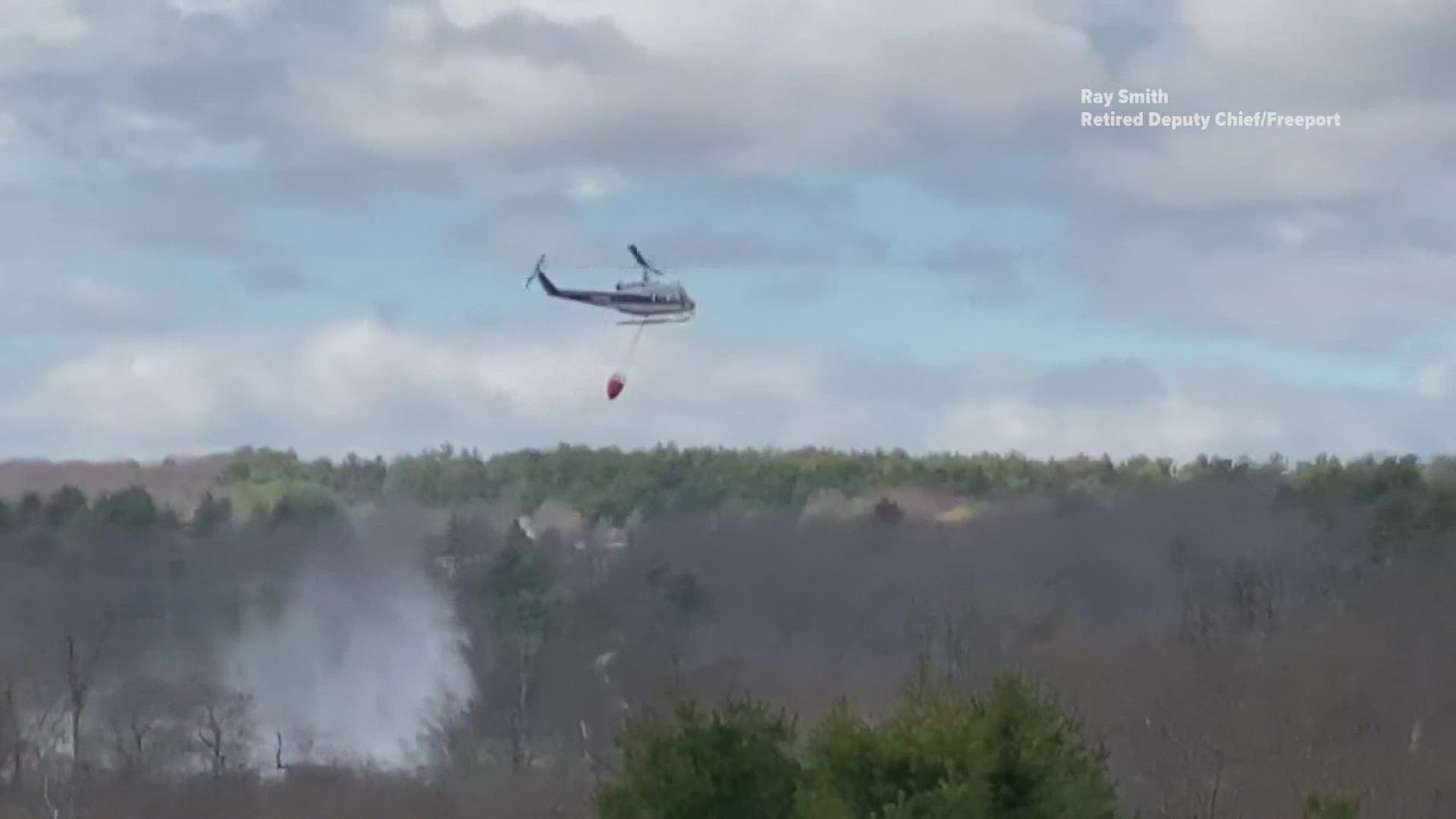 Helicopter helps quench large woods fire in New Gloucester