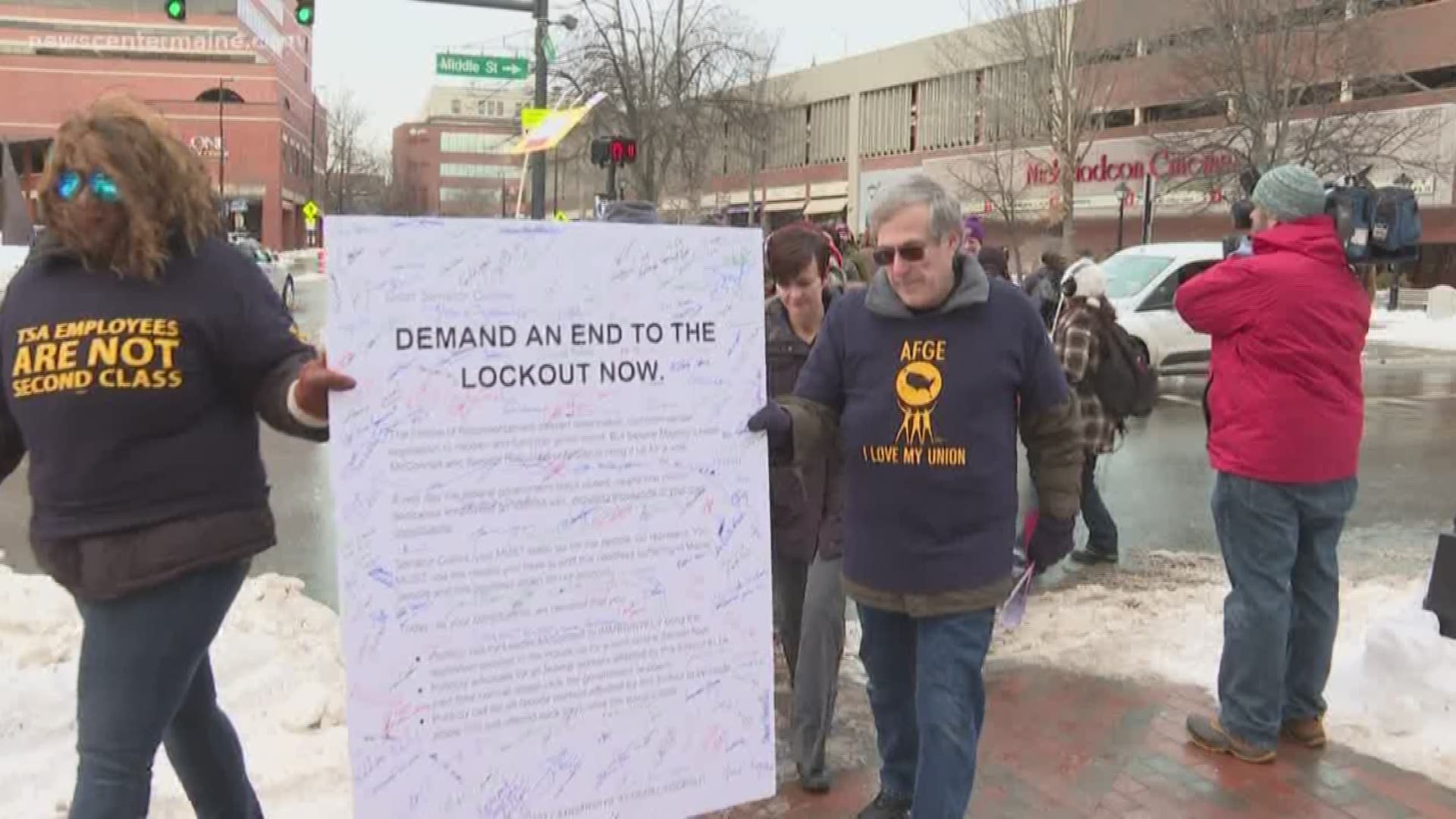 Protestors in Maine are calling on Senator Susan Collins to end the partial federal government shutdown.