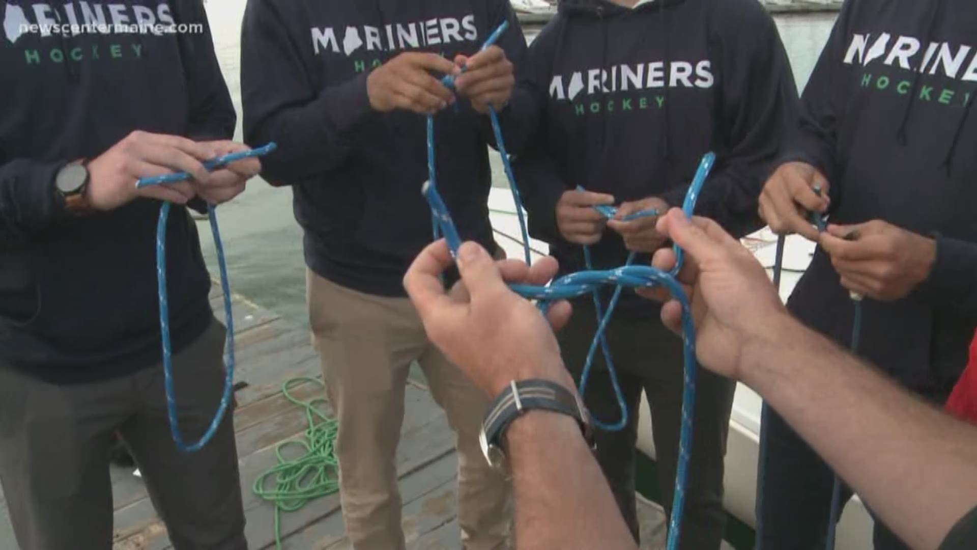 New members of the Maine Mariners hone their seafaring skills by learning to tie sailors' knots