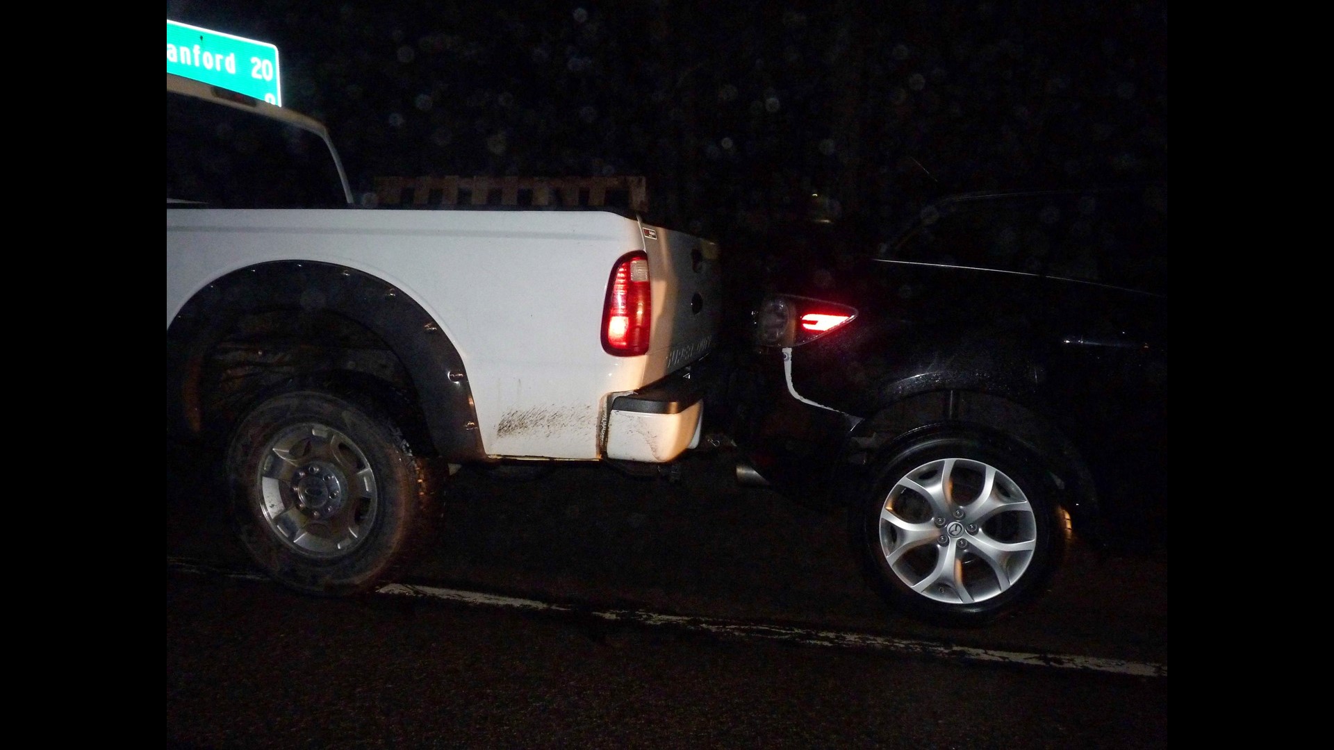 Pickup tows car in Buxton