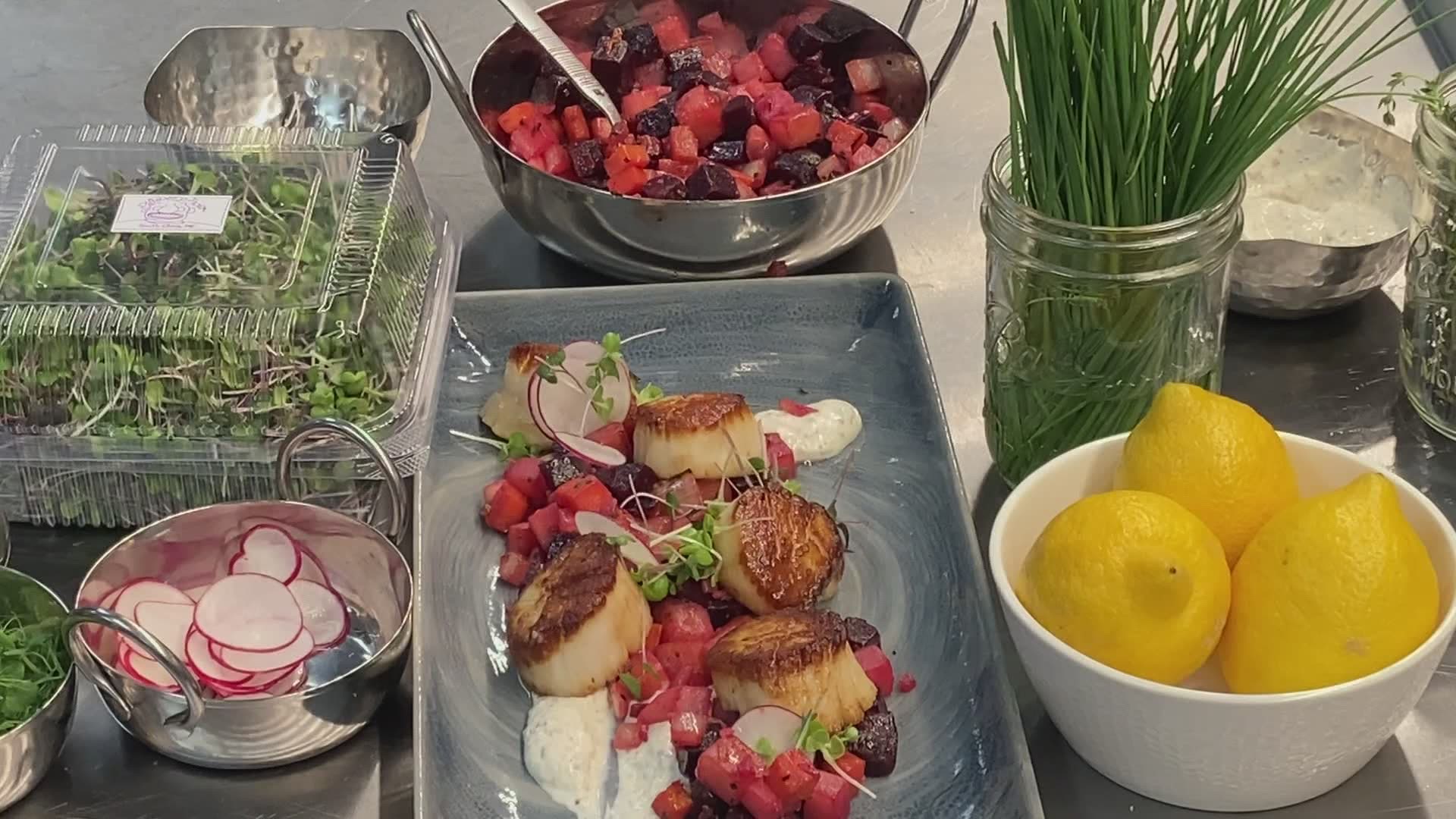 Executive Chef Jesse Souza prepares Scallops with Red Flannel Hash.