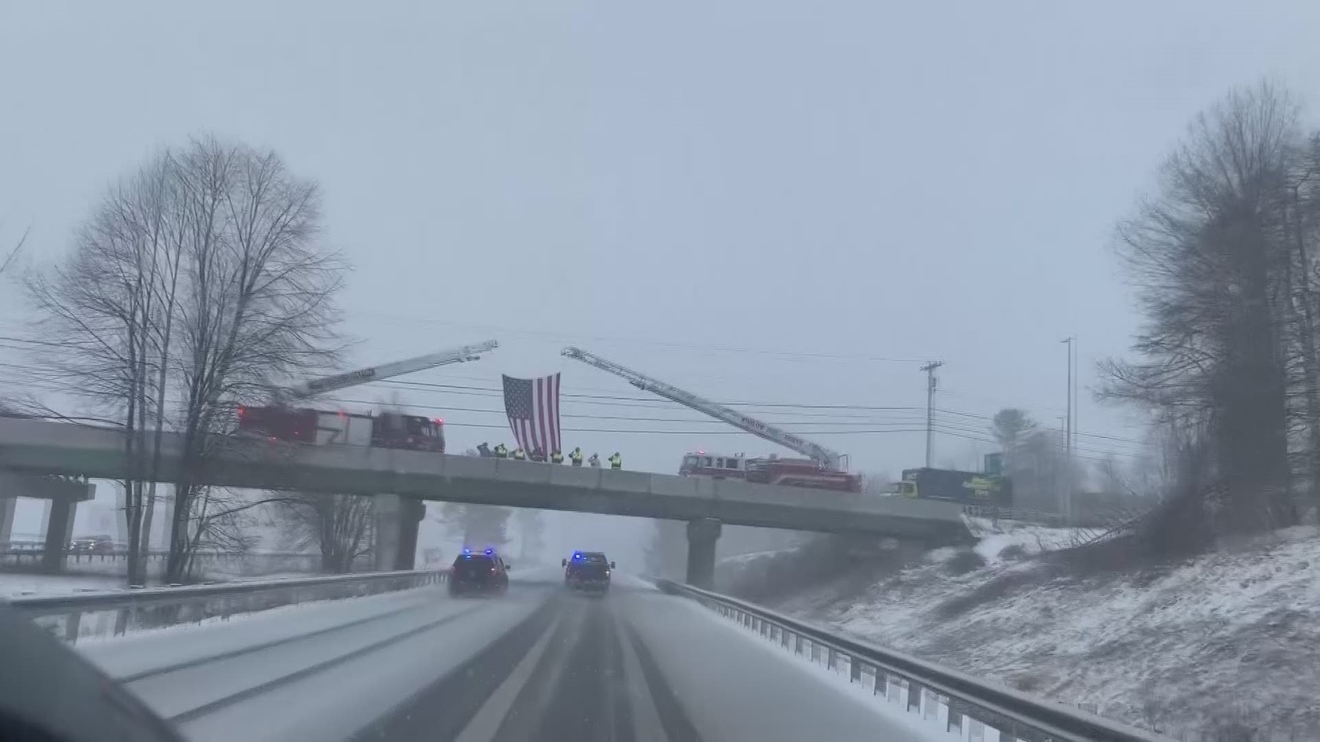 First responders took to Maine's overpasses on Monday to salute Det. Benjamin Campbell in his final journey.