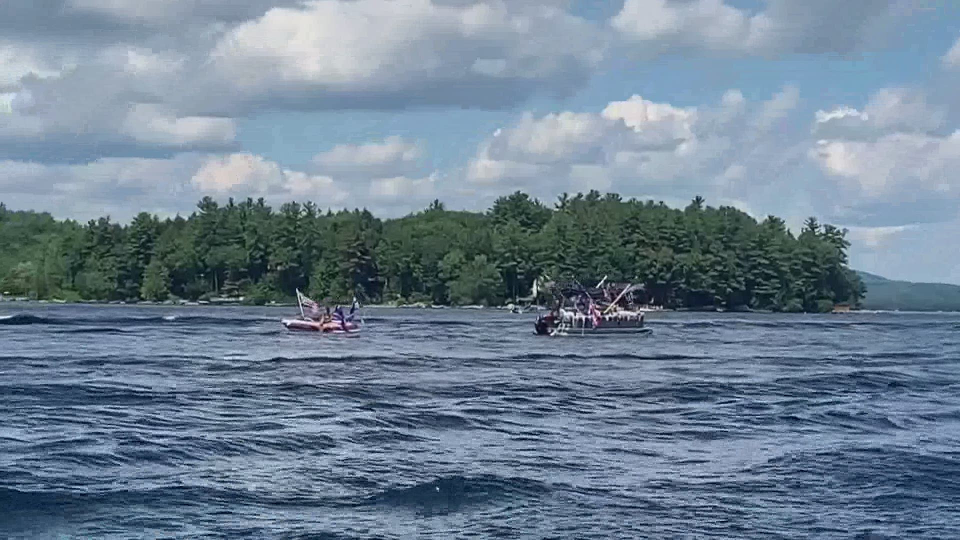 Dozens of boats filled with Trump supporters road around Sebago Lake.