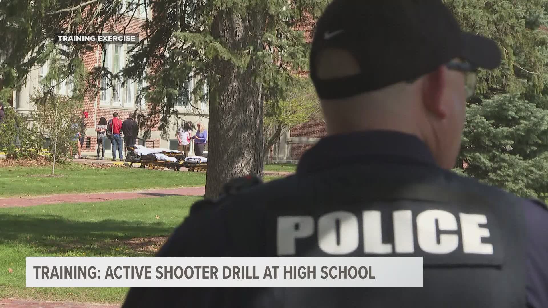 Law enforcement and fire officials take part in an active shooter training exercise.