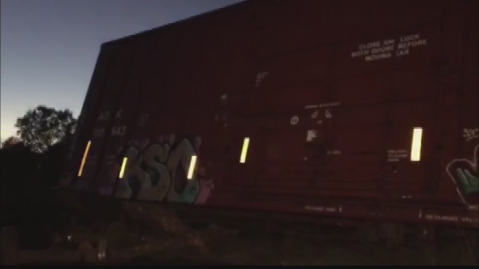 Train partially derails after colliding with tractortrailer in