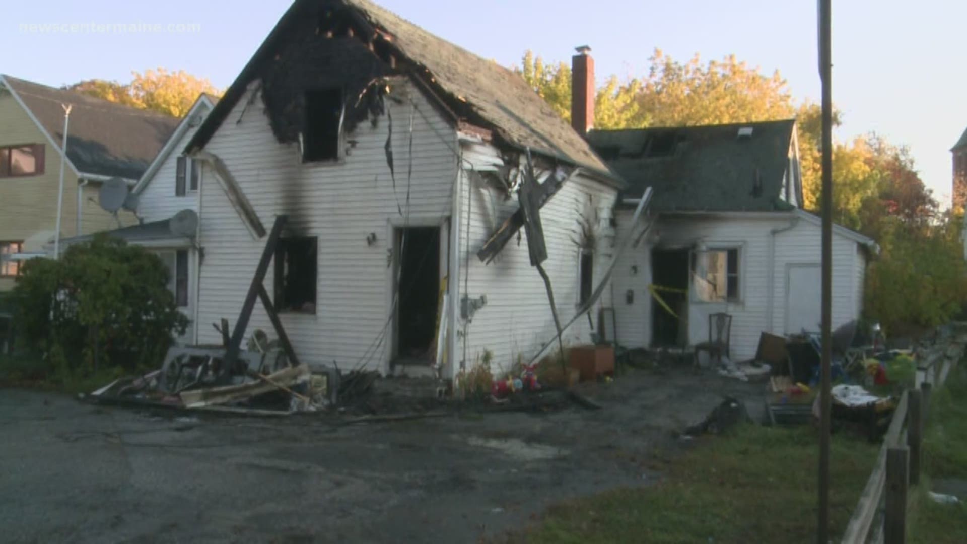 Fire officials investigate Lewiston house fire.