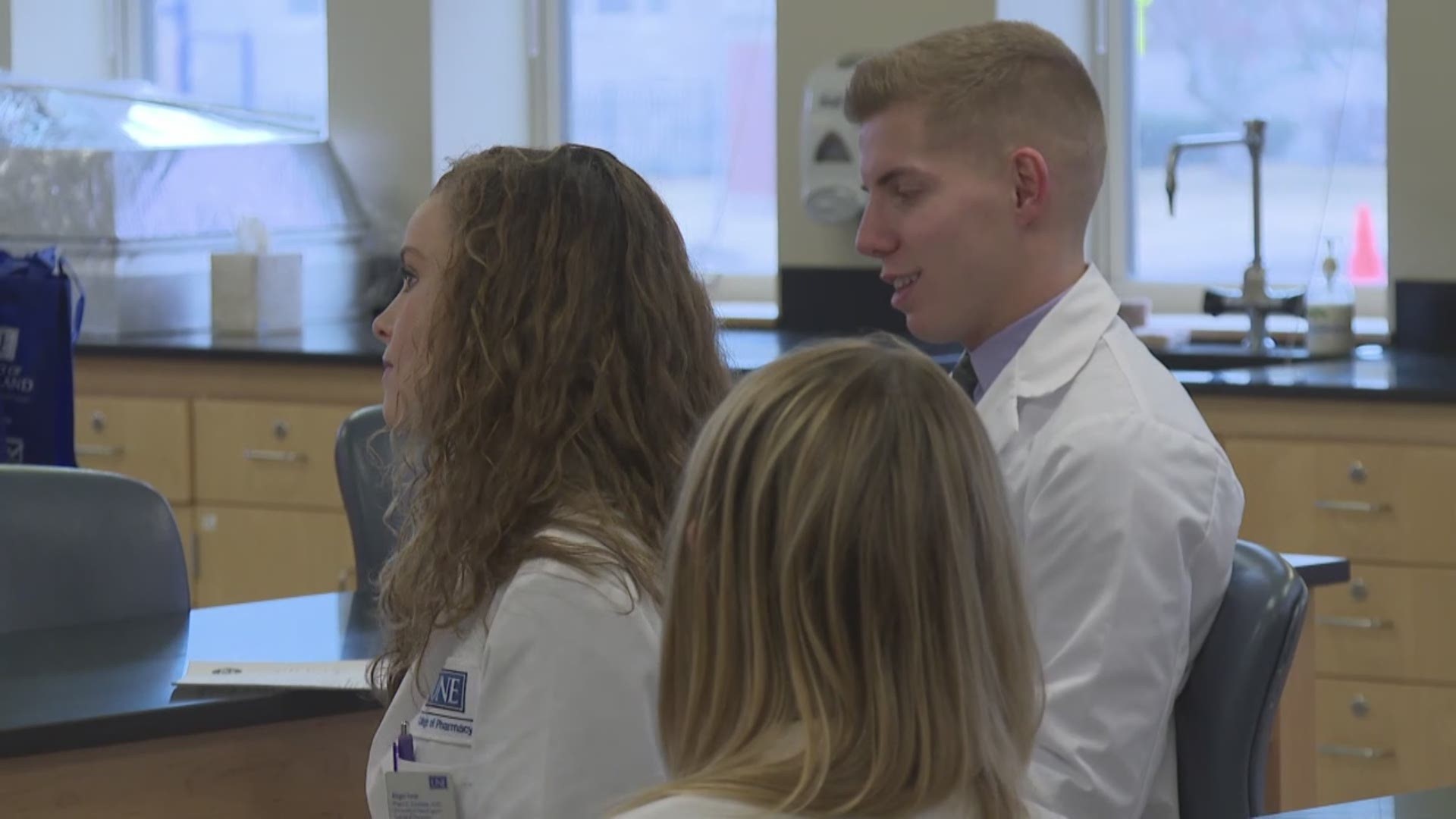 Students and faculty help with prescription and blood pressure questions at UNE in Portland