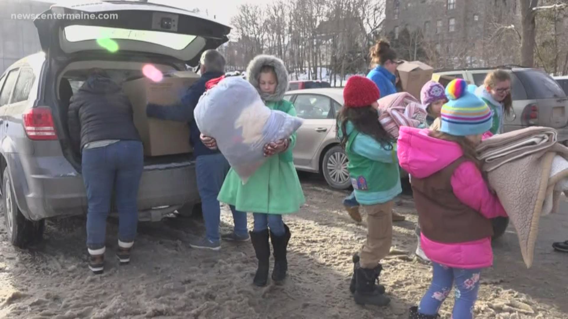 Brewer Girl Scouts give blankets to homeless
