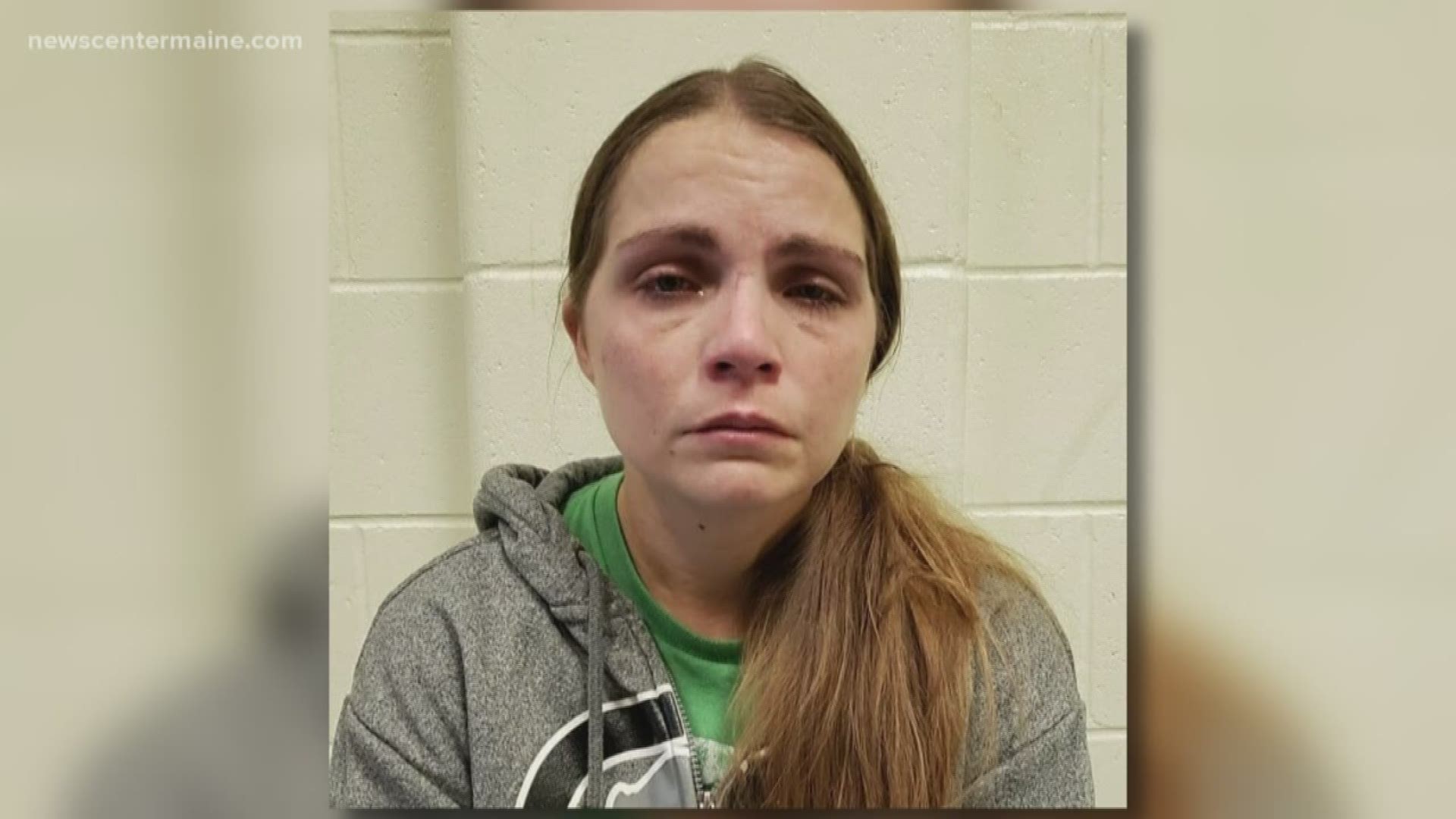 Bystanders box in the car of a woman seen driving erratically in Arundel. Kayla Libby of Westbrook was arrested for operating under the influence of drugs.