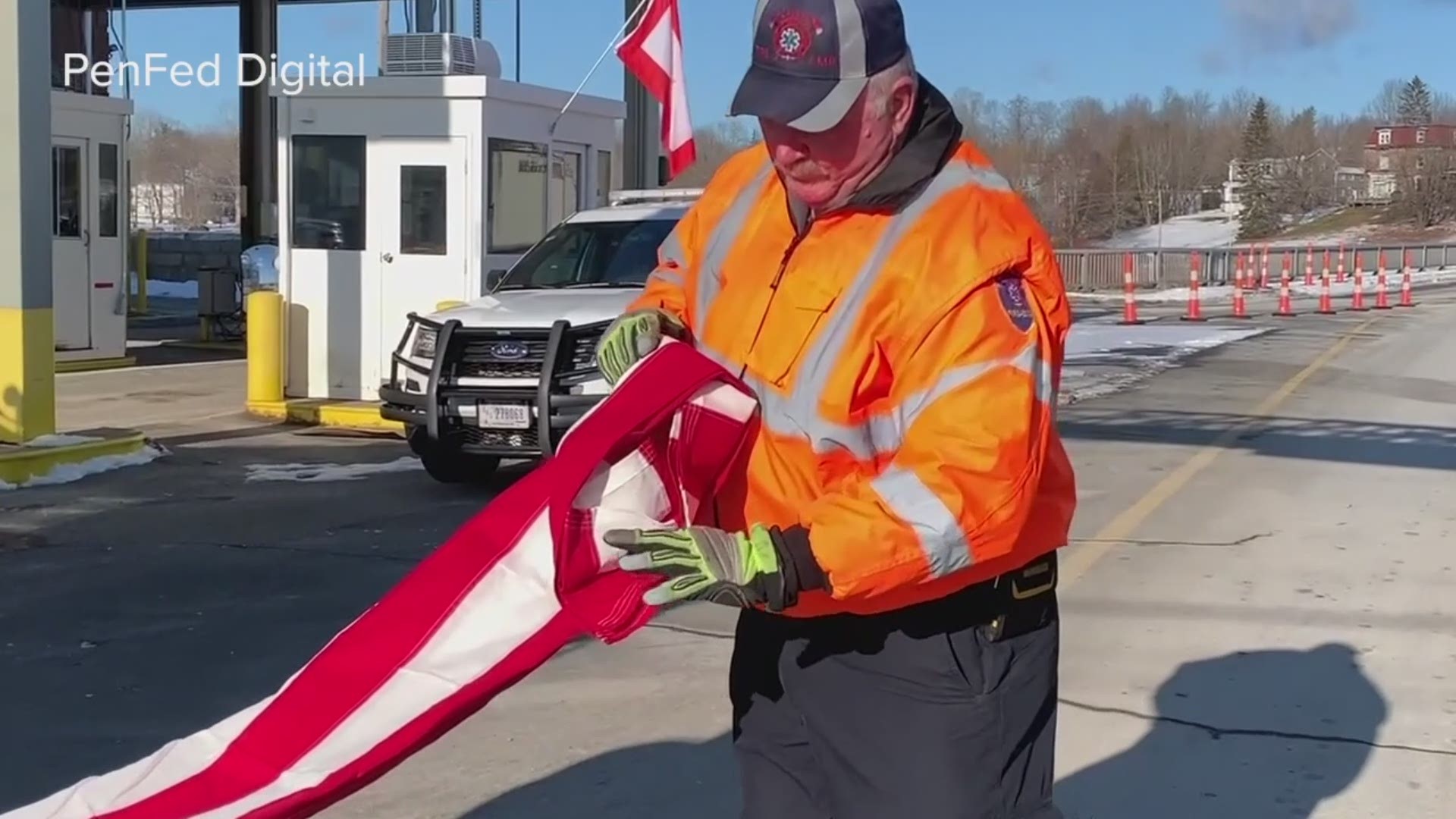 Maine firefighters fold the American flag at a Wreaths Across America ceremony Saturday