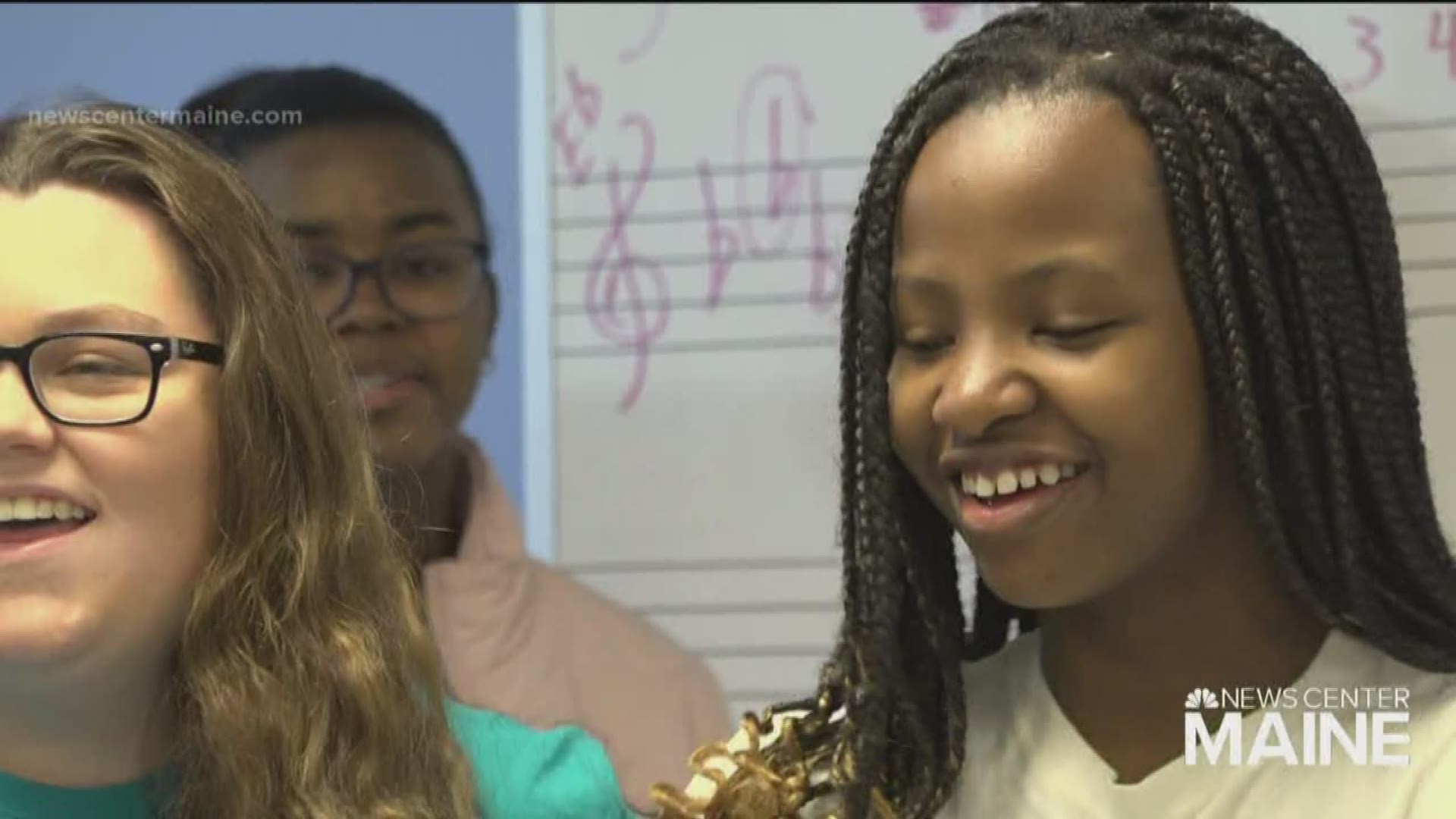 Immigrants learn English through song at Westbrook High School.