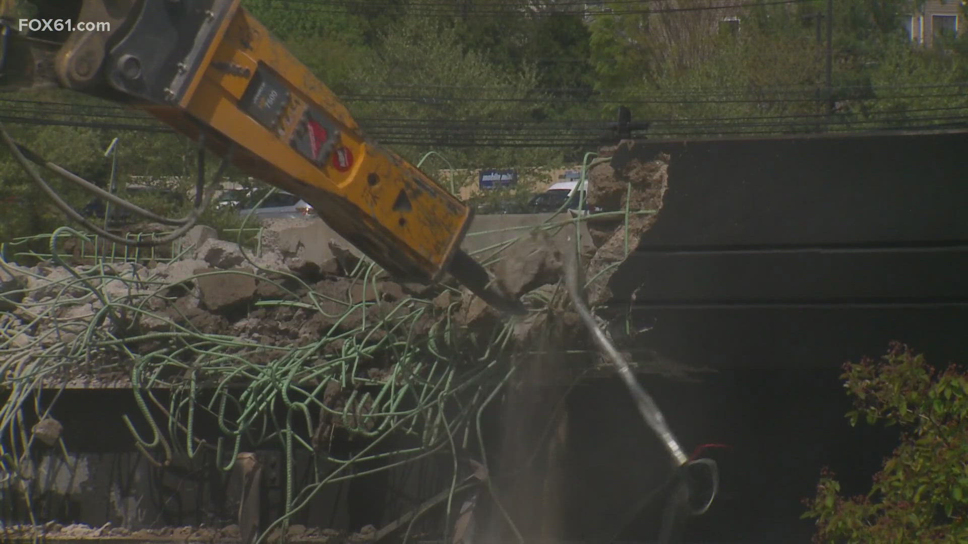 Work began Friday morning to tear down the I-95 overpass in Norwalk that was hit by an oil tanker. All three people involved walked away, but the highway is closed.